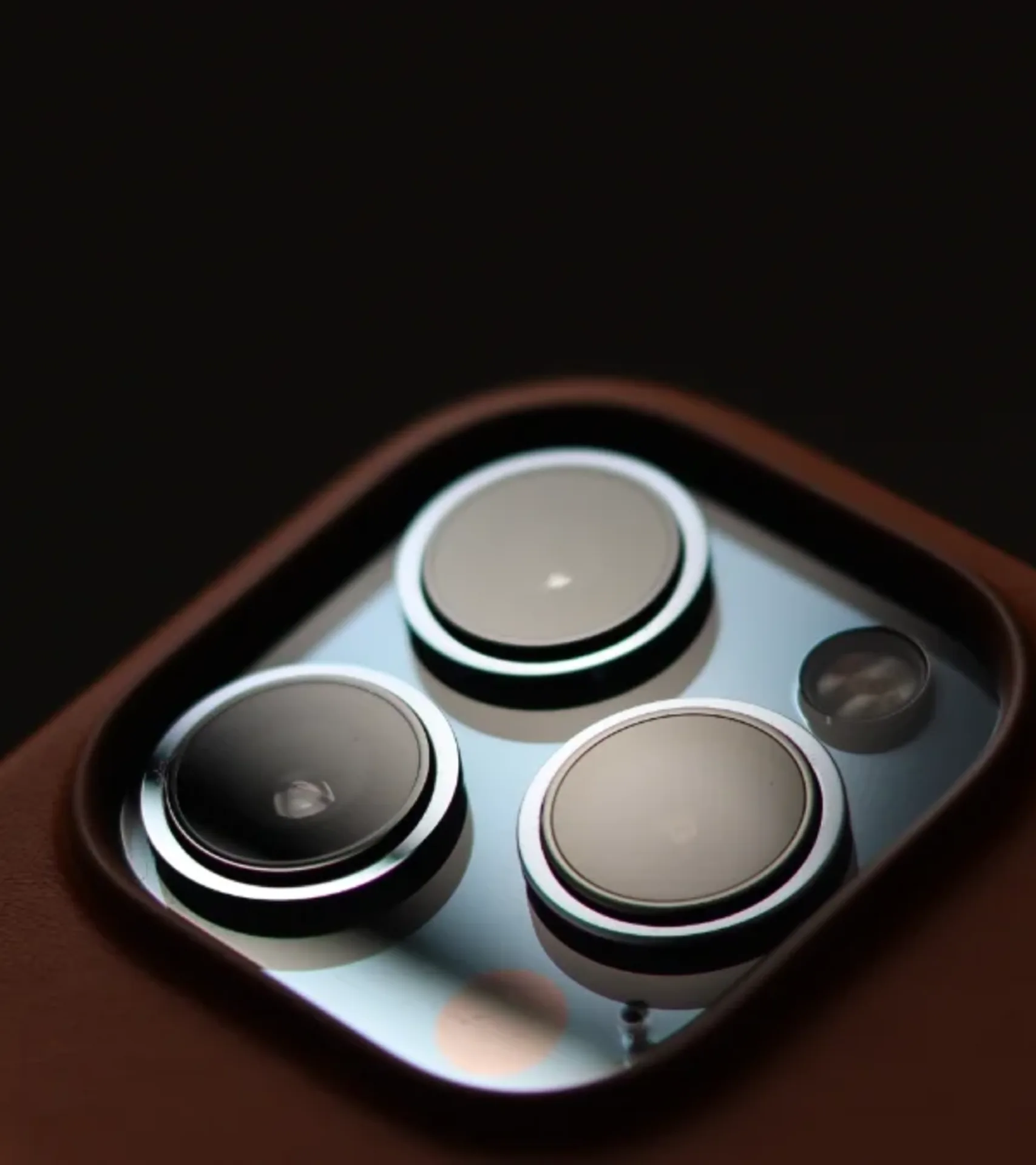 Premium electronics flatlay — phones, laptops, cameras, consoles
